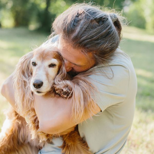 man hugging his dog because Losing a pet can feel incredibly lonely.